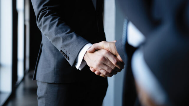 Business people shaking hands, finishing up a meeting